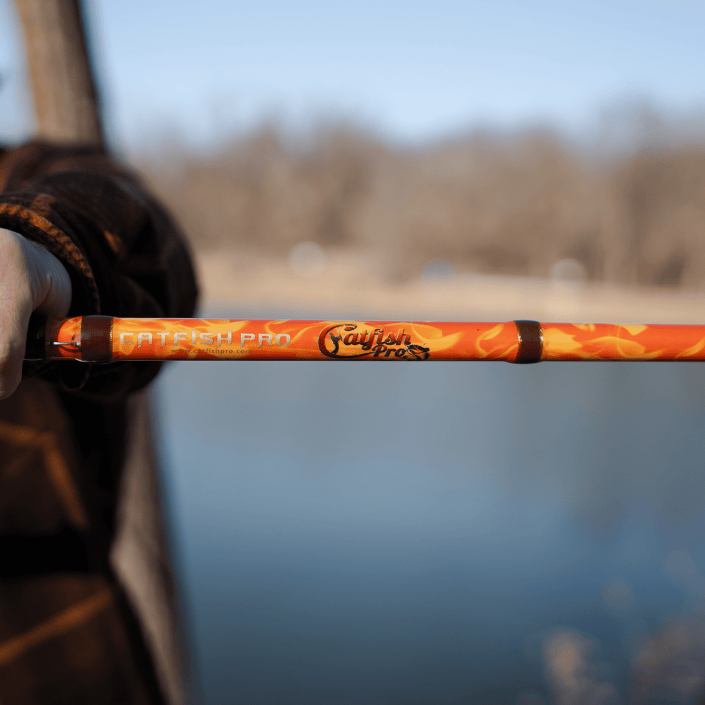 Catfish Pro Orange Dragon Fire 7'6" Glow-in-The-Dark Spinning Rod